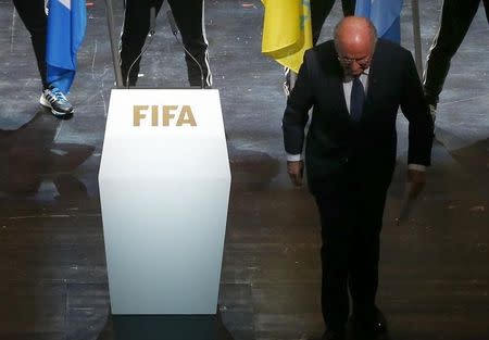 FIFA President Sepp Blatter leaves the stage after making a speech during the opening ceremony of the 65th FIFA Congress in Zurich, Switzerland, May 28, 2015. REUTERS/Arnd Wiegmann