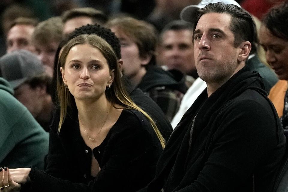 Green Bay Packers quarterback Aaron Rodgers watches during the second half of an NBA basketball game between the Milwaukee Bucks and the Los Angeles Lakers Friday, Dec. 2, 2022, in Milwaukee