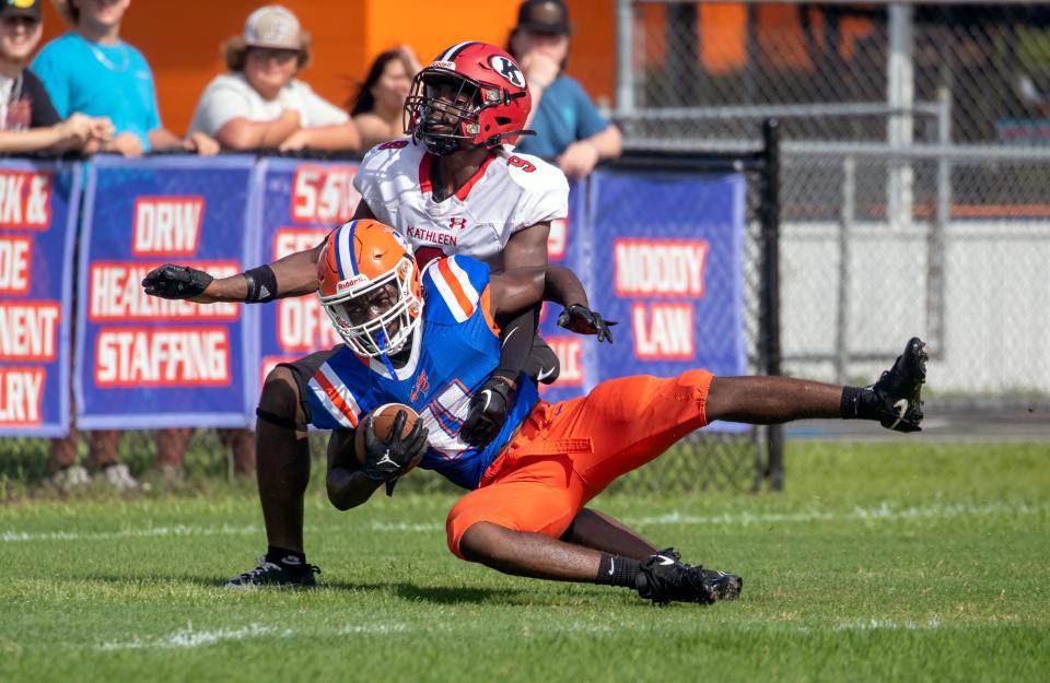 Bartow wide receiver Ka'marion Thomas scores on a 43-yard pass from KJ Valentine as Kathleen's Corion Abram defends on Saturday morning at Bartow Memorial Stadium.
