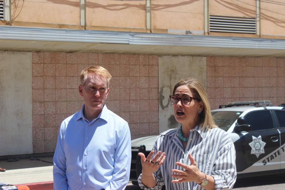 Sens. Kyrsten Sinema, I-Ariz., and James Lankford, R-Okla., speak outside of the Morely gate after touring the Dennis DeConcini Port of Entry in Nogales, Arizona, on Wednesday, May 24, 2023.