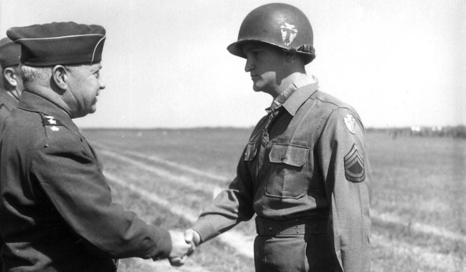 Army Technical Sergeant Charles H. Coolidge receives the Medal of Honor from Lieutenant General Wade H. Haislip during a battlefield ceremony near Dormstadt, Germany, June 18, 1945.