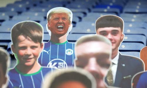 Wigan v Stoke City - Sky Bet Championship - DW Stadium<br>A cardboard cutout of Donald Trump (top row, left) in the stands before the Sky Bet Championship match at the DW Stadium, Wigan. PA Photo. Issue date: Tuesday June 30, 2020. See PA story SOCCER Wigan. Photo credit should read: Martin Rickett/PA Wire. RESTRICTIONS: EDITORIAL USE ONLY No use with unauthorised audio, video, data, fixture lists, club/league logos or "live" services. Online in-match use limited to 120 images, no video emulation. No use in betting, games or single club/league/player publications.