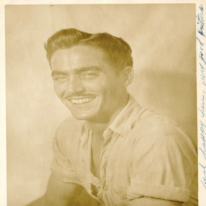 A man sitting for a photograph