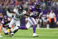 Aug 18, 2018; Minneapolis, MN, USA; Minnesota Vikings running back Latavius Murray (25) carries the ball past Jacksonville Jaguars linebacker Telvin Smith (50) during the first quarter at U.S. Bank Stadium. Mandatory Credit: Brace Hemmelgarn-USA TODAY Sports