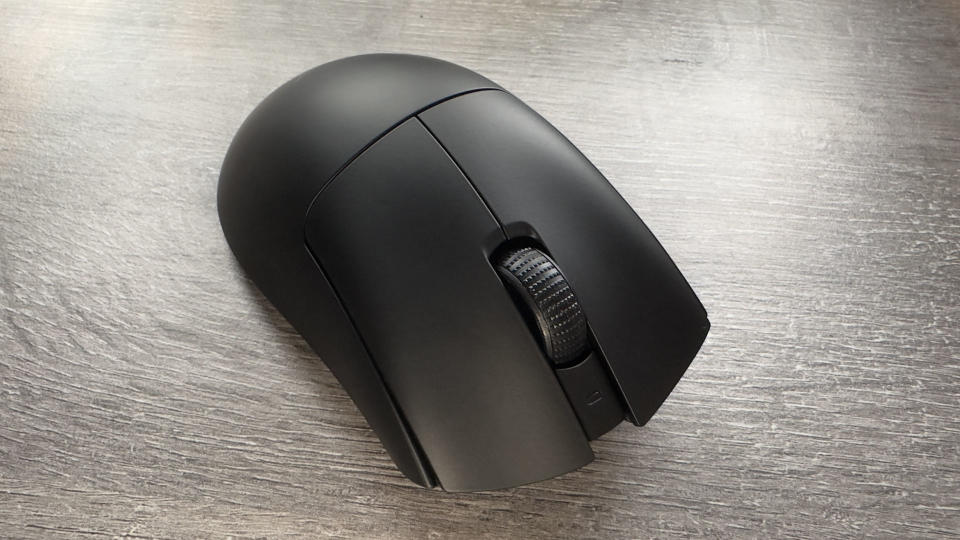 A photo of a Razer DeathAdder V3 HyperSpeed gaming mouse resting on an office desk