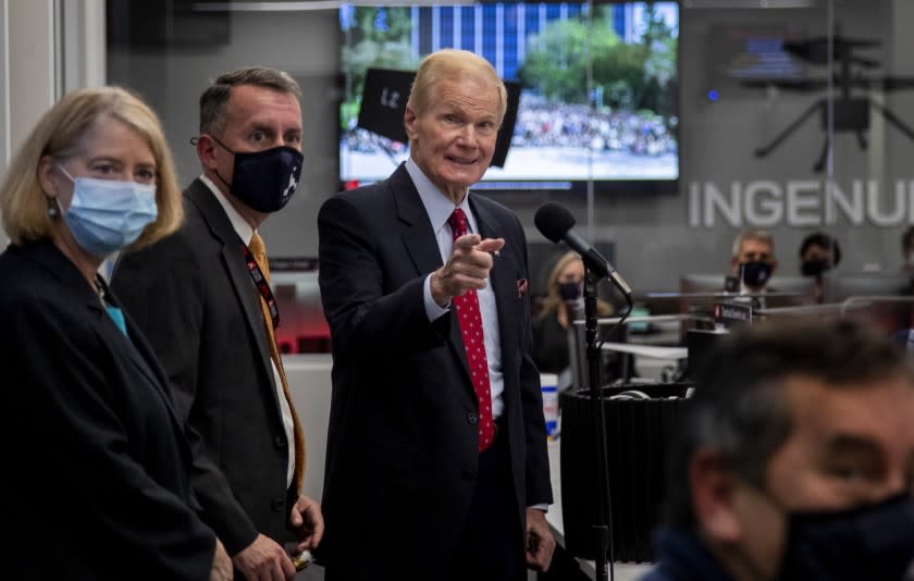 PASADENA CA - OCTOBER 14, 2021: NASA Administrator Bill Nelson, right, takes questions after speaking to the team at the Mars 2020 Perseverance Rover Mission Operations area on October 14, 2021at JPL in Pasadena, California. NASA Deputy Administrator Pam Melroy, left, and Bobby Braun, Director for Planetary Science, JPL, is in the middle.(Gina Ferazzi / Los Angeles Times)