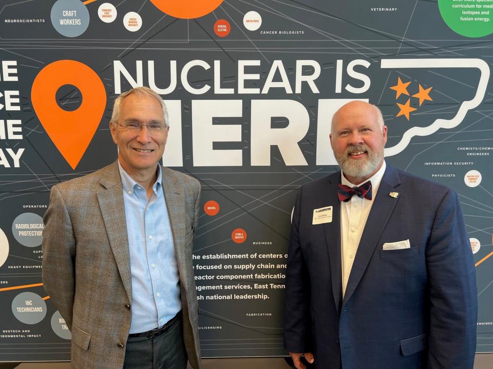 Retired interim director of ORNL Jeff Smith, left, gave Roane State Community College President Chris Whaley a check for $100,000 to start a nuclear technology program at the school.