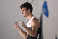 Nathaniel Coleman, of the United States, celebrates after reaching the top during the bouldering portion of the men's sport climbing final at the 2020 Summer Olympics, Thursday, Aug. 5, 2021, in Tokyo, Japan. (AP Photo/Jeff Roberson)