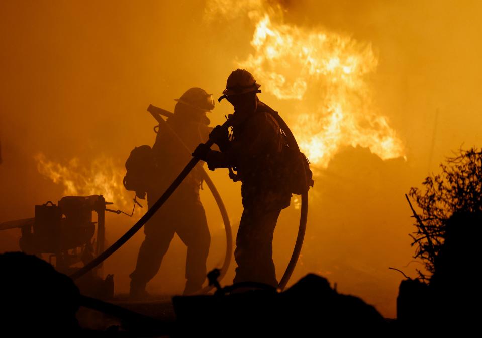 Firefighters work as Park Fire burns near Chico, California, U.S. July 25, 2024. REUTERS/Fred Greaves