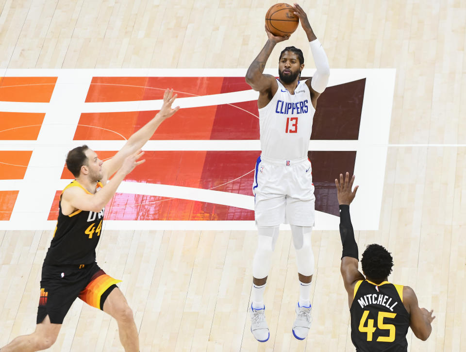 SALT LAKE CITY, UTAH - JUNE 16: Paul George #13 of the Los Angeles Clippers shoots against Donovan Mitchell #45 and Bojan Bogdanovic #44 of the Utah Jazz in Game Five of the Western Conference second-round playoff series at Vivint Smart Home Arena on June 16, 2021 in Salt Lake City, Utah. NOTE TO USER: User expressly acknowledges and agrees that, by downloading and/or using this photograph, user is consenting to the terms and conditions of the Getty Images License Agreement. (Photo by Alex Goodlett/Getty Images)