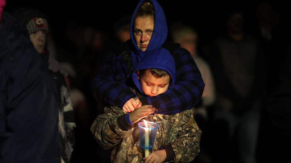 Community members gather in Wiese park for a candlelight vigil at the Perry Middle School and High School complex on January 04, 2024 in Perry, Iowa. A 17-year-old student identified by authorities as Dylan Butler opened fire at the school on the first day back from the winter break, killing a student and wounding five others. Investigators say they believe the shooter died of a self-inflicted gunshot.