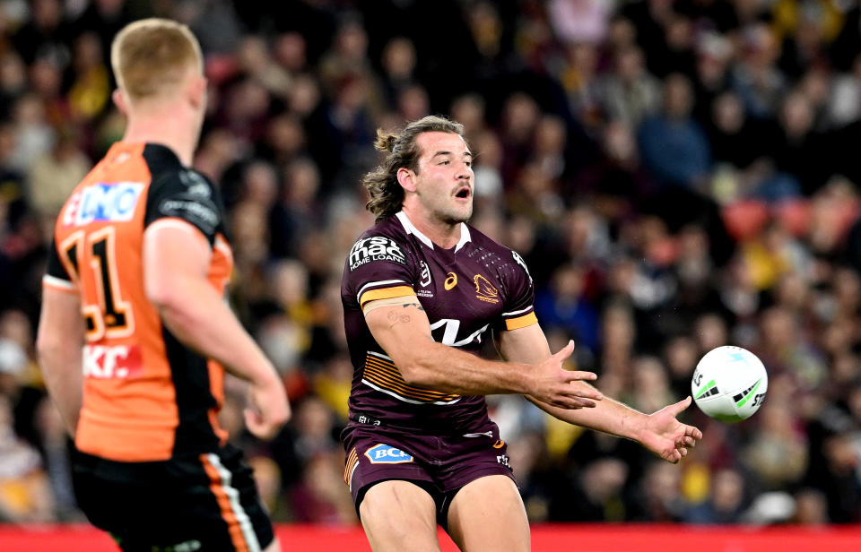 BRISBANE, AUSTRALIA - JULY 30: Patrick Carrigan of the Broncos passes the ball during the round 20 NRL match between the Brisbane Broncos and the Wests Tigers at Suncorp Stadium, on July 30, 2022, in Brisbane, Australia. (Photo by Bradley Kanaris/Getty Images)