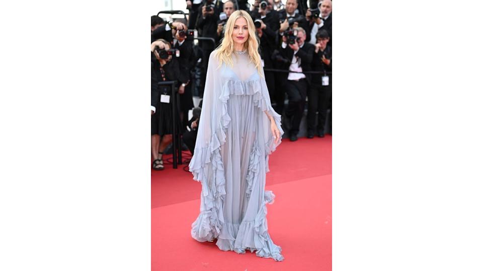 Sienna Miller wearing a blue frill-lined gown at Cannes Film Festival