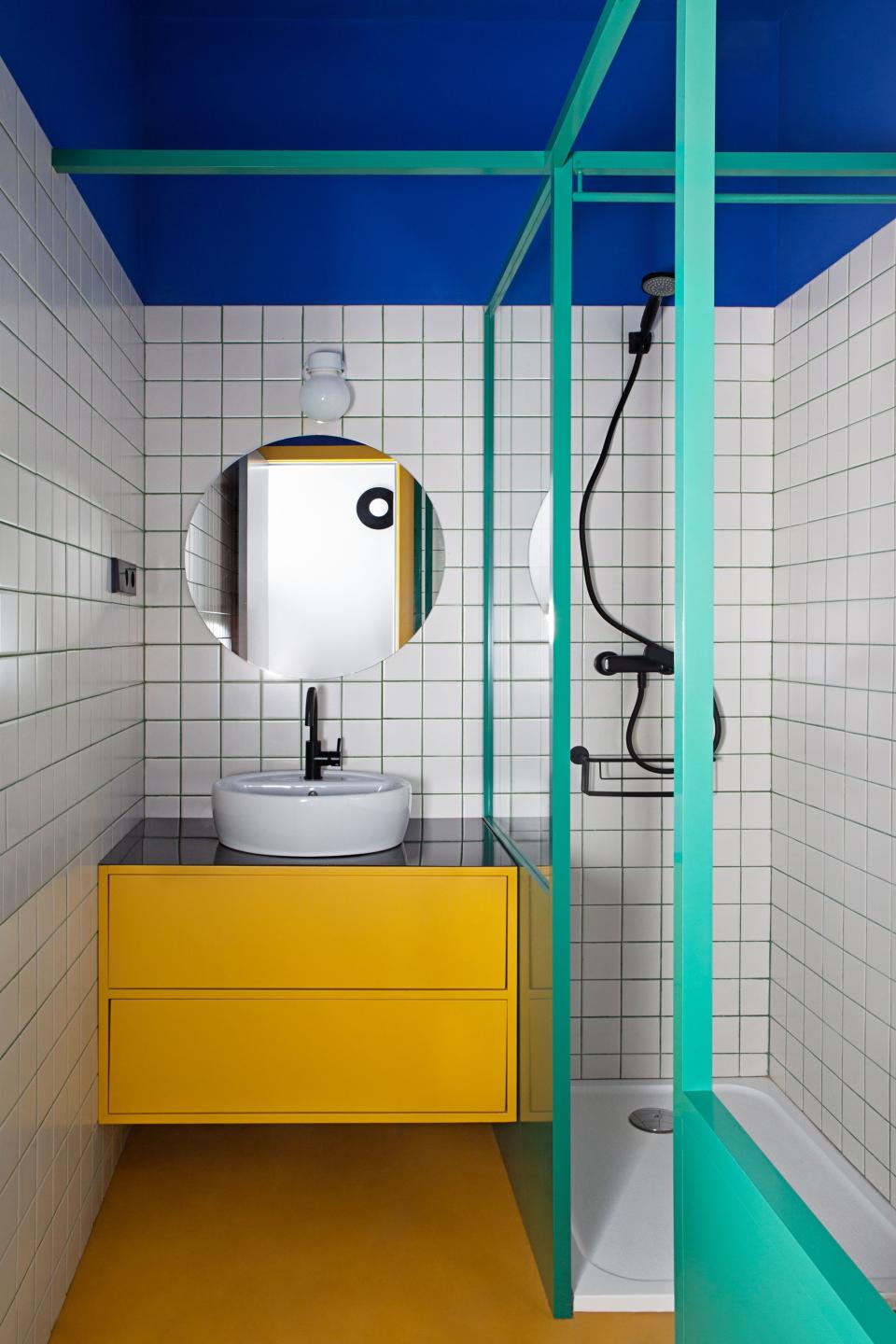 After: The third bathroom is the most vibrant of all, inspired by the vivid hues found at the Majorelle Garden in Marrakech. Even the grout is eye-catching; the duo developed its teal color with the installer.