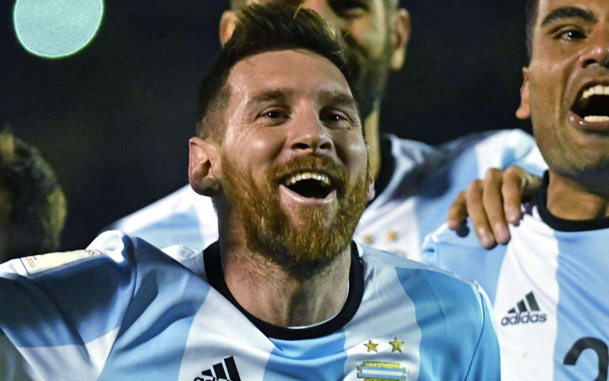 Argentina's Lionel Messi celebrates after defeating Ecuador  - AFP