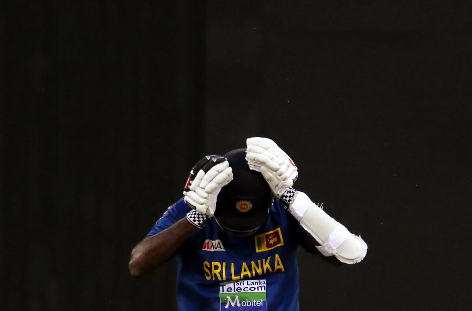 Sri Lanka's Angelo Mathews reacts after he was run out for 12 runs during their one-day international cricket match against Australia at the Melbourne Cricket Ground January 11, 2013. REUTERS/David Gray (AUSTRALIA - Tags: SPORT CRICKET TPX IMAGES OF THE DAY)