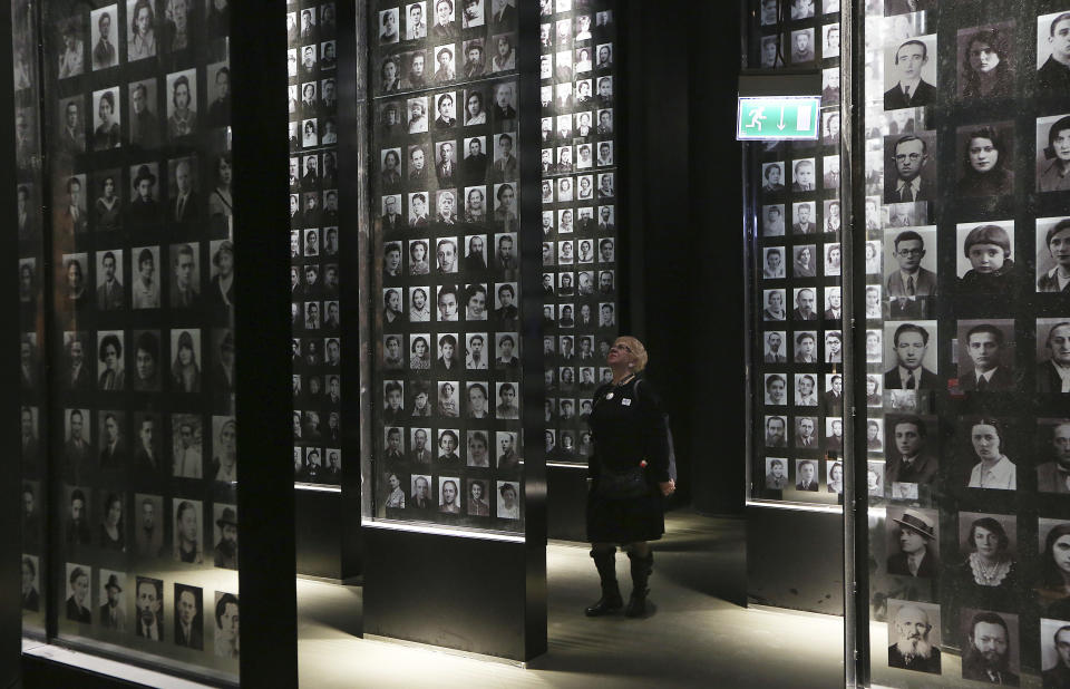 A visitor looks at an exhibit in the Museum of the Second World War, an ambitious new museum under creation for nine years has opened its doors for a day to historians, museums and reporters in Gdansk, Poland, on Monday, Jan. 23, 2017. (AP Photo/Czarek Sokolowski)