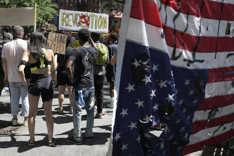 Protesters, many from the former encampment at City Hall Park, gather for a march in New York, Tuesday, July 28, 2020. (AP Photo/Seth Wenig)