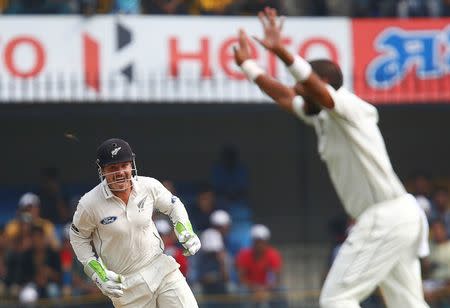 Cricket - India v New Zealand - Third Test cricket match - Holkar Cricket Stadium, Indore, India - 08/10/2016. New Zealand's Bradley-John Watling (L) and Jeetan Patel celebrate after the wicket of India's Murali Vijay. REUTERS/Danish Siddiqui