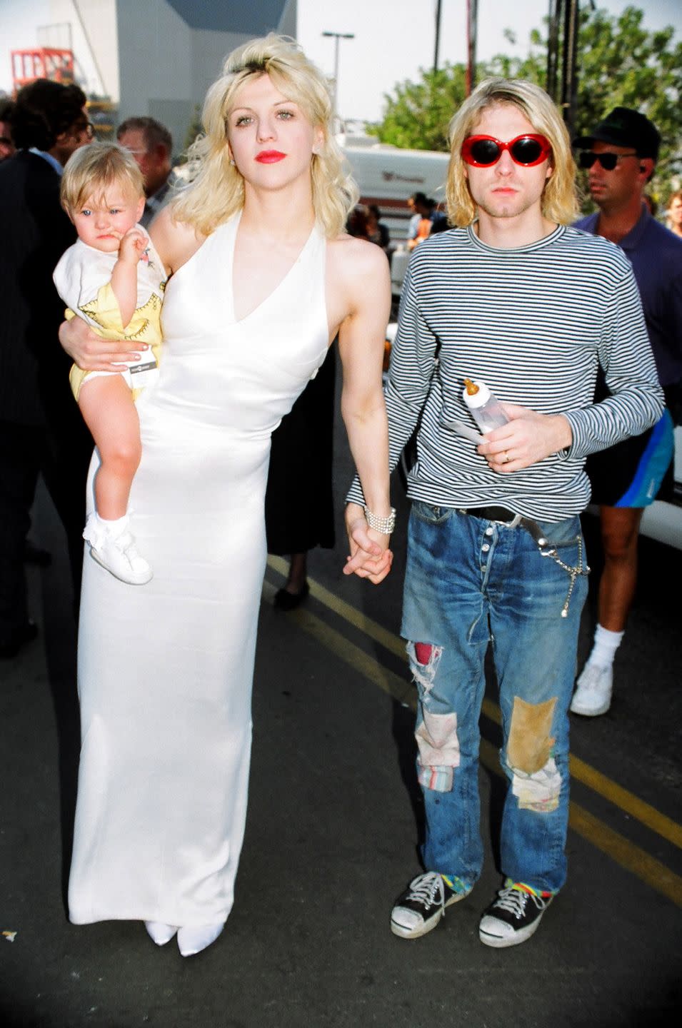 <p>Kurt Cobain: 5' 9"<br>Courtney Love: 5' 9" (taller in heels)</p>