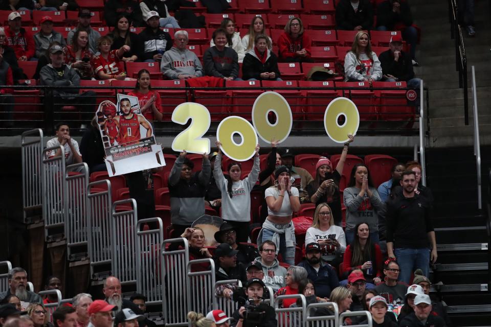 Jan 30, 2023; Lubbock, Texas, USA; Texas Tech Red Raiders fans celebrate Texas Tech Red Raiders forward Kevin Obanor (0) scoring his 2000 career goal against the  Iowa State Cyclones in the first half at United Supermarkets Arena. Mandatory Credit: Michael C. Johnson-USA TODAY Sports ORG XMIT: IMAGN-512080 ORIG FILE ID:  20230130_tdc_aj7_0233.JPG