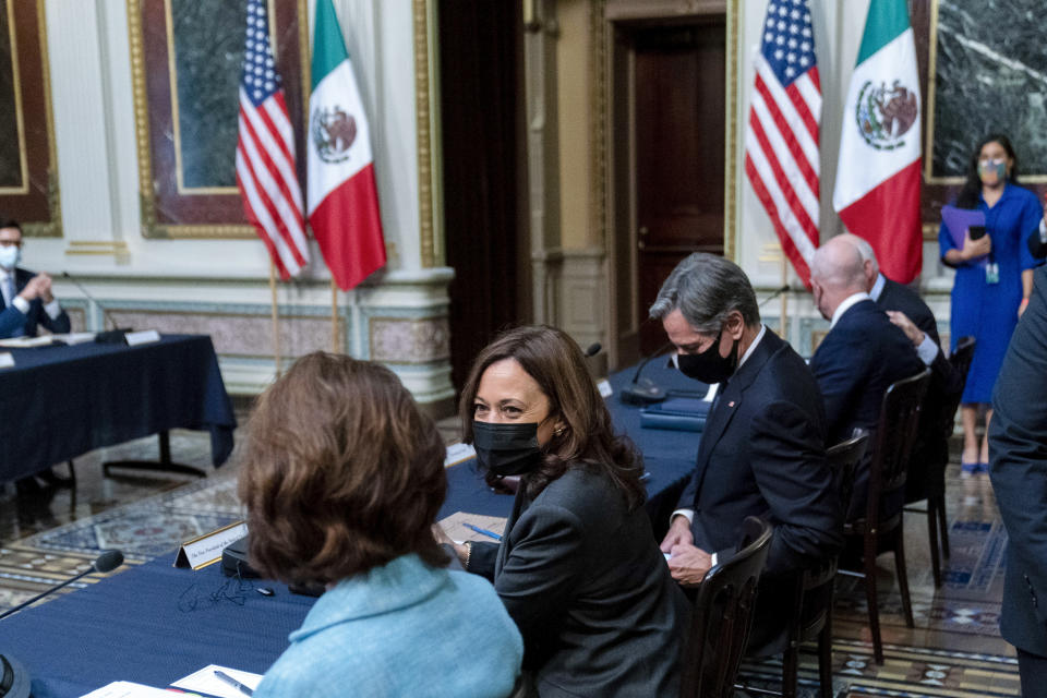 Vice President Kamala Harris, center, accompanied by Secretary of State Antony Blinken, center right, speaks with Commerce Secretary Gina Raimondo, left, at a U.S.-Mexico High Level Economic Dialogue meeting in the Indian Treaty Room in the Eisenhower Executive Office Building on the White House Campus in Washington, Thursday, Sept. 9, 2021. (AP Photo/Andrew Harnik)