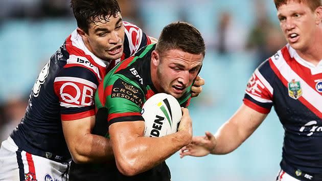 Sam Burgess is tackled by the Roosters. Pic: Getty