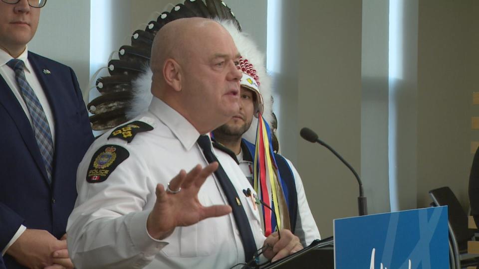 Edmonton Police Chief Dale McFee addresses the news conference as Treaty 6 Grand Chief Cody Thomas looks on. 