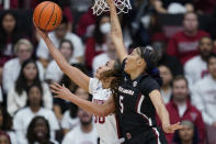 Stanford guard Haley Jones shoots the ball while defended by South Carolina forward Victaria Saxton (5) during the first half of an NCAA college basketball game in Stanford, Calif., Sunday, Nov. 20, 2022. (AP Photo/Godofredo A. Vásquez)