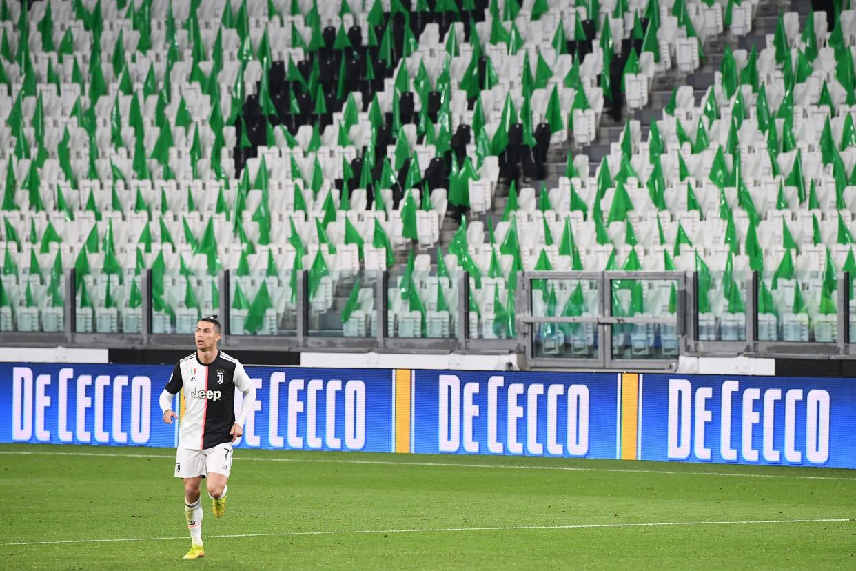 TOPSHOT - Juventus' Portuguese forward Cristiano Ronaldo runs on the pitch in an empty stadium due to the novel coronavirus outbreak during the Italian Serie A football match Juventus vs Inter Milan, at the Juventus stadium in Turin on March 8, 2020. (Photo by Vincenzo PINTO / AFP) (Photo by VINCENZO PINTO/AFP via Getty Images)