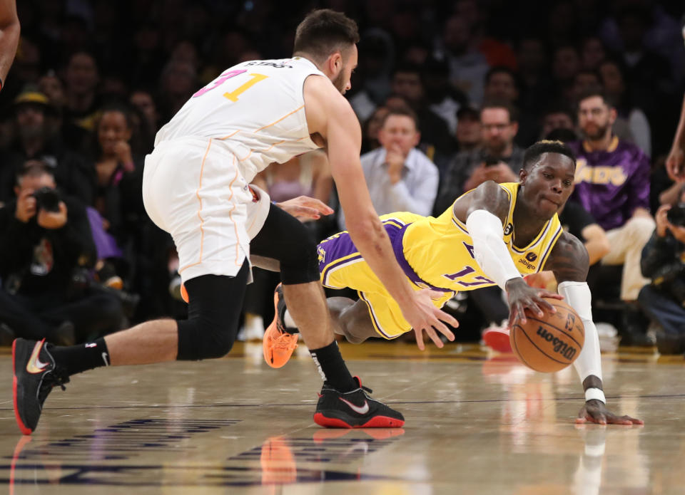 Los Angeles, CA - January 04: Lakers guard Dennis Schroder, right, battles Heat guard Max Strus for a loose ball in the first half at Crypto.Com Arena in Los Angeles  Wednesday, Jan. 4, 2023. (Allen J. Schaben / Los Angeles Times via Getty Images)