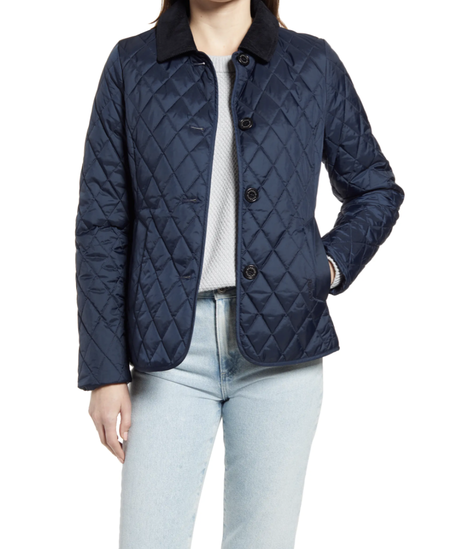 model wearing navy Barbour Sterndale Quilted Jacket a white t-shirt and light wash jeans 