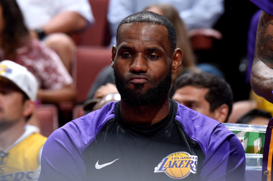 Lakers forward LeBron James sits out his new team’s preseason loss to the Clippers. (Getty Images)
