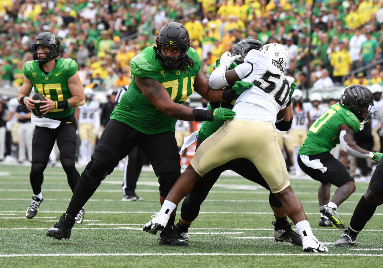 EUGENE, OR - SEPTEMBER 23: Oregon Ducks offensive lineman Steven Jones (74) pass blocks against Colorado Buffaloes defensive end J.J. Hawkins (50) during a PAC-12 conference football game between the Colorado Buffaloes and Oregon Ducks on September 23, 2023 at Autzen Stadium in Eugene, Oregon. (Photo by Brian Murphy/Icon Sportswire via Getty Images)