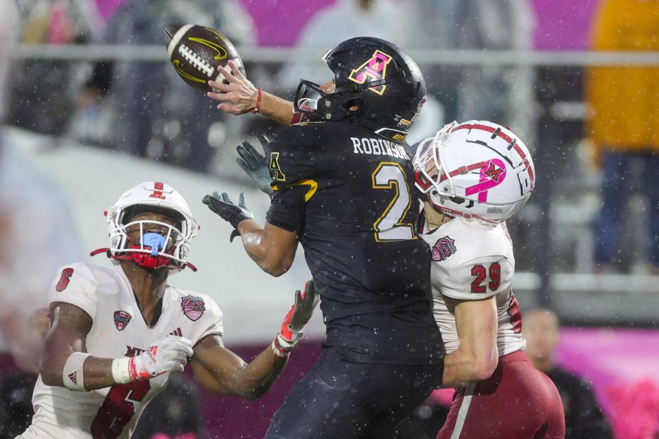 Dec 16, 2023; Orlando, FL, USA; Miami (OH) Redhawks defensive back Silas Walters (29) breaks up a pass intended for Appalachian State Mountaineers wide receiver Kaedin Robinson (2) in the second quarter during the Avocados from Mexico Cure Bowl at FBC Mortgage Stadium.