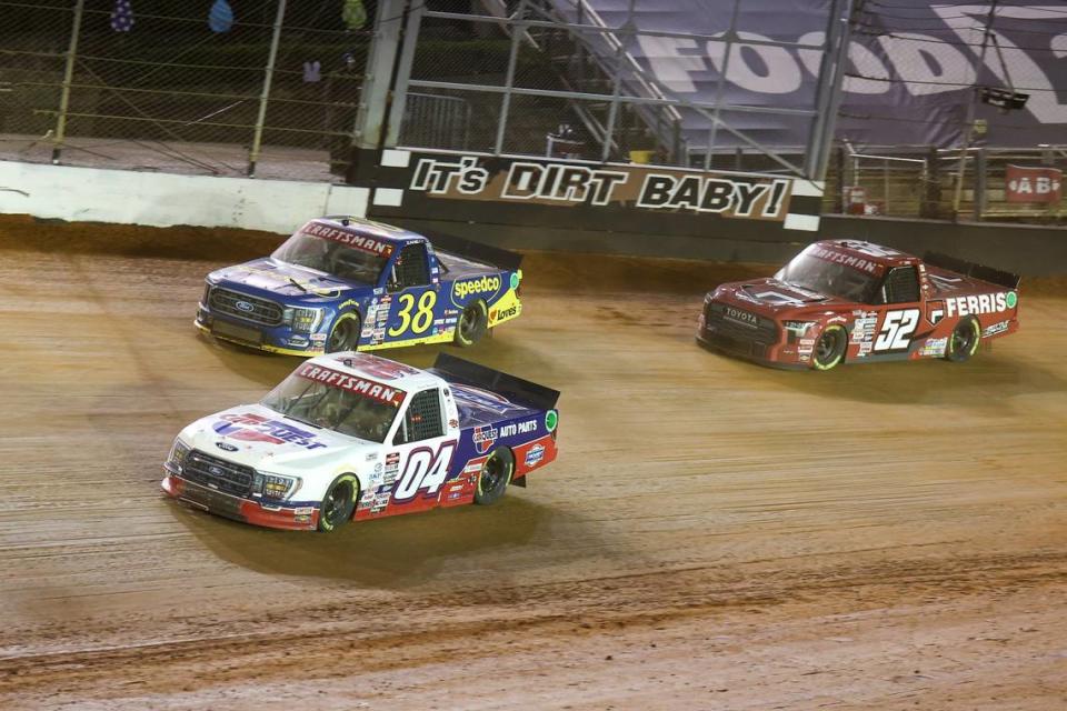 Apr 8, 2023; Bristol, Tennessee, USA; NASCAR Gander RV and Outdoors Truck Series driver Kaden Honeycutt (04) and driver Zane Smith (38) and driver Stewart Friesen (52) at Bristol Motor Speedway Dirt Course. Mandatory Credit: Randy Sartin-USA TODAY Sports