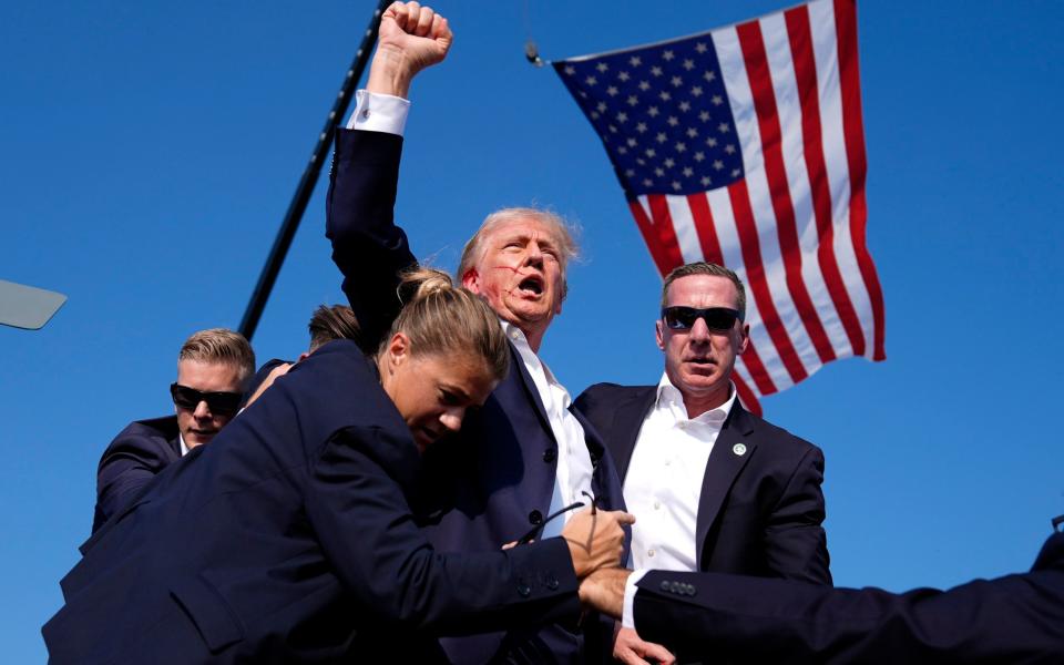 Trump pumped a fist in the air after the attack