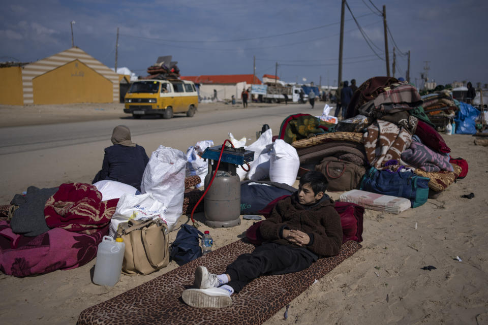 Palestinians arrive in the southern Gaza town of Rafah after fleeing an Israeli ground and air offensive in the nearby city of Khan Younis on Wednesday, Jan. 24, 2024. Israel has expanded its offensive in Khan Younis, saying the city is a stronghold of the Hamas militant group. (AP Photo/Fatima Shbair)