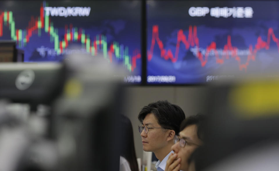 Currency traders watch their computer monitors at the foreign exchange dealing room in Seoul, South Korea, Tuesday, Sept. 3, 2019. Asian stock markets were mostly lower Tuesday after investor jitters over U.S.-Chinese trade tension were revived by a report negotiators cannot agree on a schedule for talks this month. (AP Photo/Lee Jin-man)