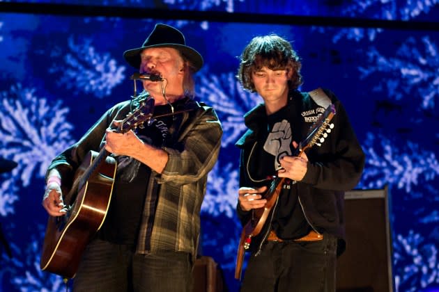 Neil Young and Micah Nelson onstage at Farm Aid in 2017. Nelson has joined Crazy Horse and will tour with Young and the band this summer. - Credit: Ebet Roberts/Getty Images