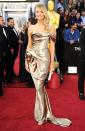 Stacy Keibler <br>Grade: C <br><br>George Clooney's gal pal may be gorgeous, but she failed to impress in her gold lame off-the-shoulder Marchesa creation and lackluster blond locks.