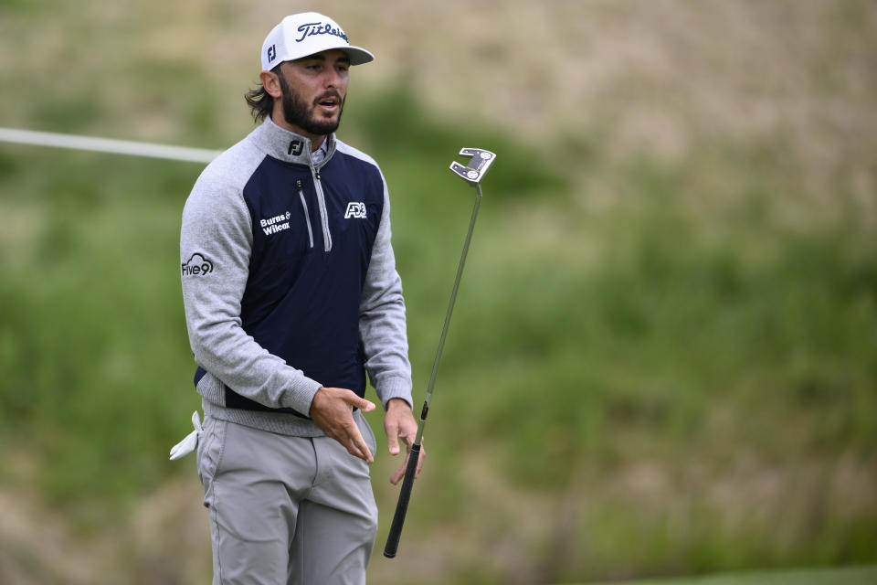 Max Homa reacts after missing a putt on the 14th hole during the final round of the Wells Fargo Championship golf tournament, Sunday, May 8, 2022, at TPC Potomac at Avenel Farm golf club in Potomac, Md. (AP Photo/Nick Wass)