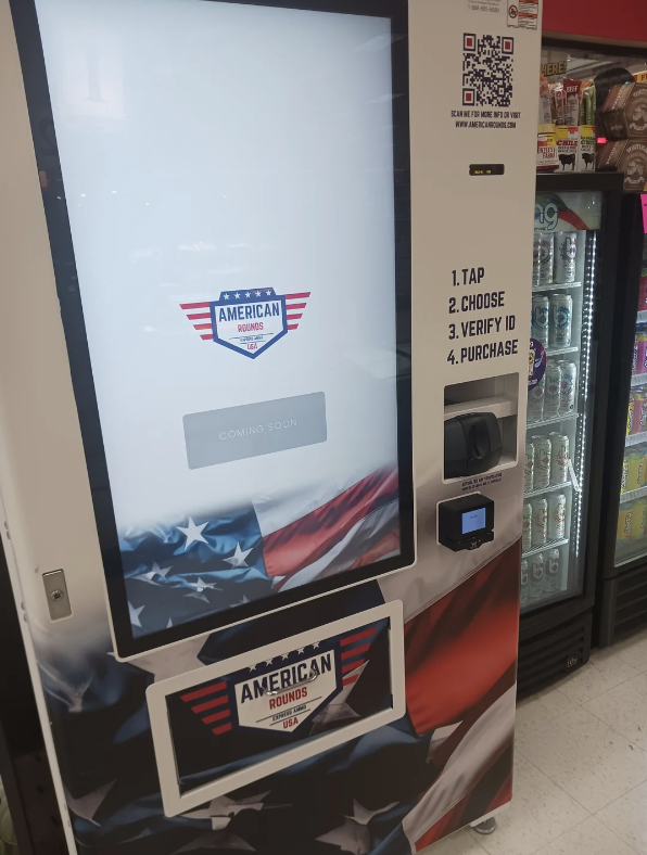 Vending machine with "American Rounds" branding, instructions to tap, verify ID, and purchase, and a draped flag design. Coming soon