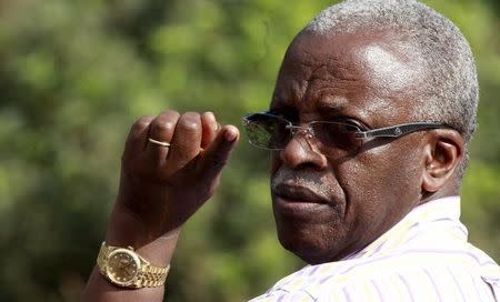 Uganda's former Prime Minister Amama Mbabazi gestures as he arrives to attend a gathering in Jinja town in eastern Uganda September 10, 2015. REUTERS/James Akena