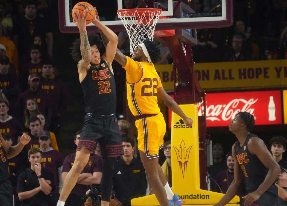 ASU Sun Devil forward Warren Washington (22) fights for a rebound with USC Trojans guard Tre White (22) at Desert Financial Arena in Tempe on Jan. 21, 2023.