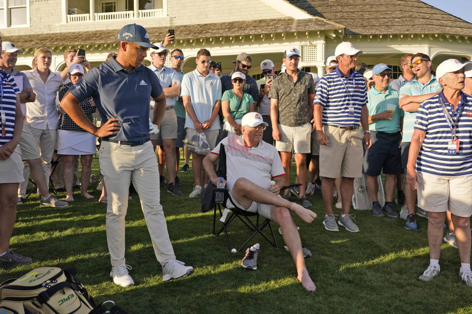 Xander Schauffele waits for a ruling after his ball landed under a fan on the 18th hole during the second round of the PGA Championship golf tournament on the Ocean Course Friday, May 21, 2021, in Kiawah Island, S.C. (AP Photo/Chris Carlson)