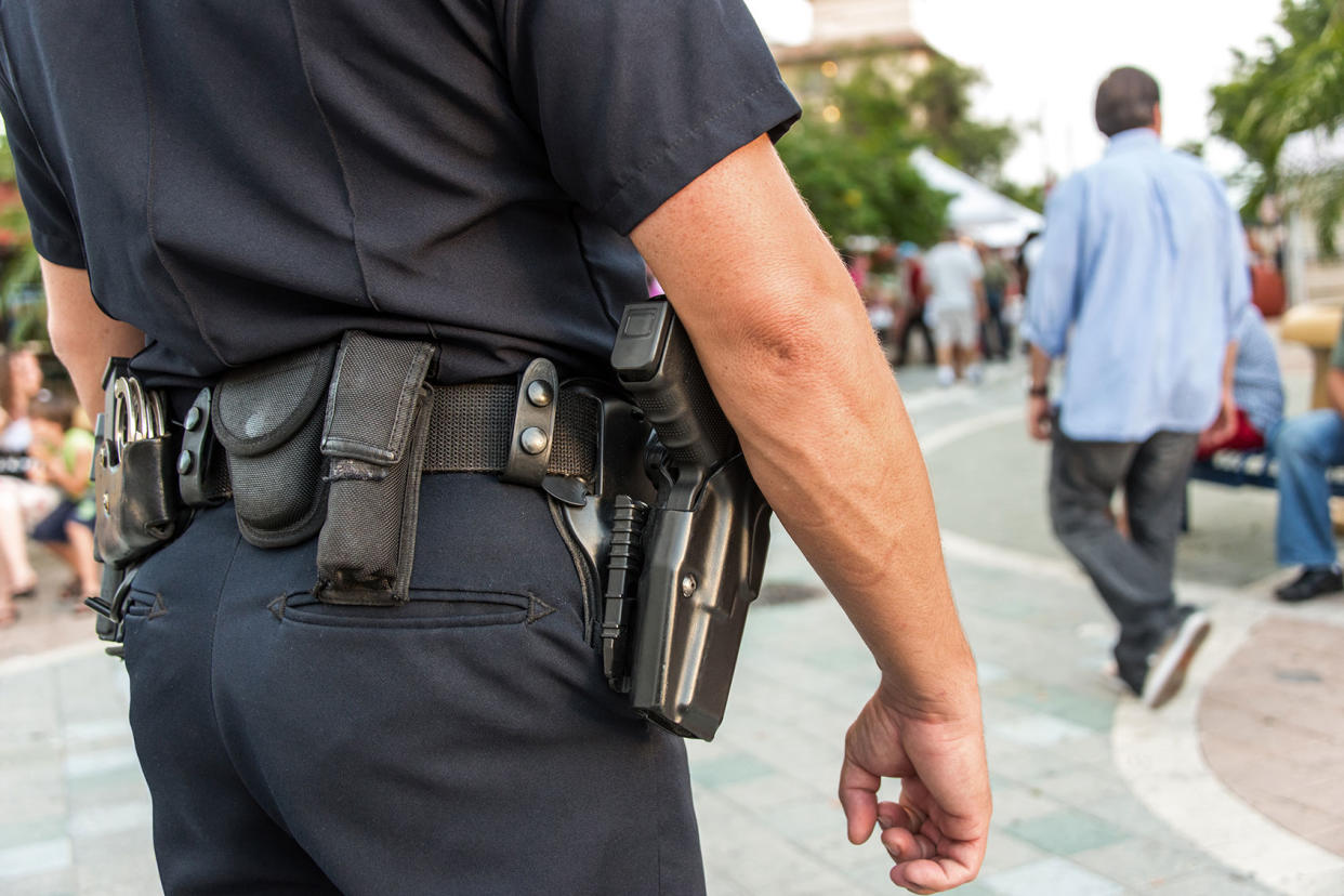 Police Law Enforcement Gun Getty Images/Juanmonino