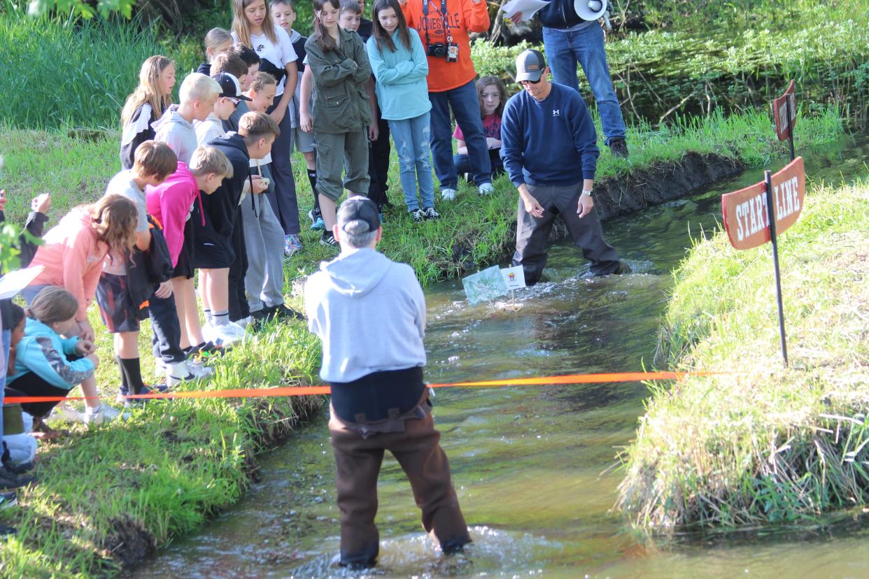 Williams Elementary students line the banks of the St. Joe River in Jonesville during the annual boat races.