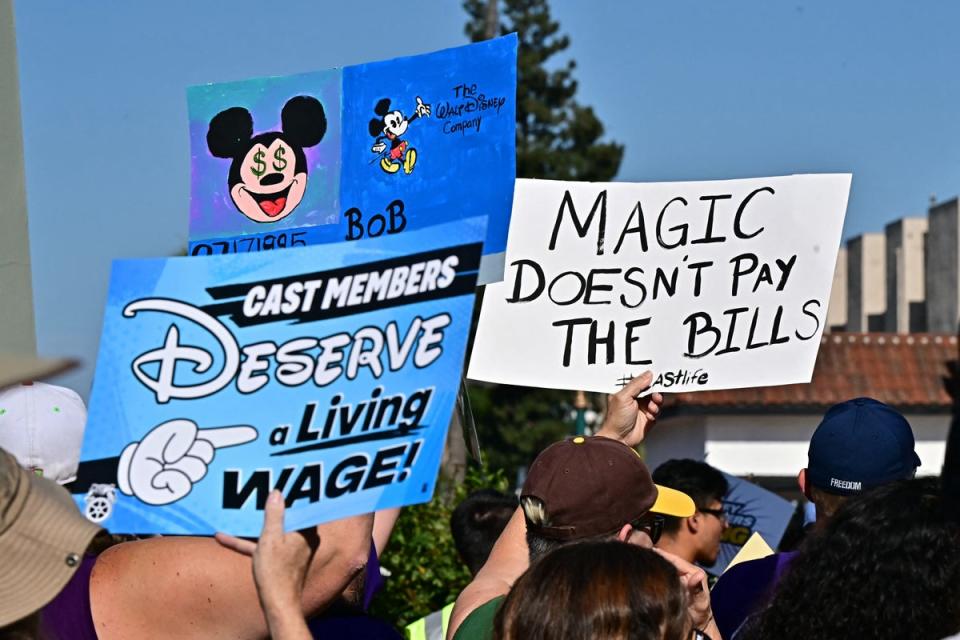 Disney employees rally outside the main entrance of Disneyland Resort in Anaheim, California, ahead of a planned strike authorization vote (AFP via Getty Images)