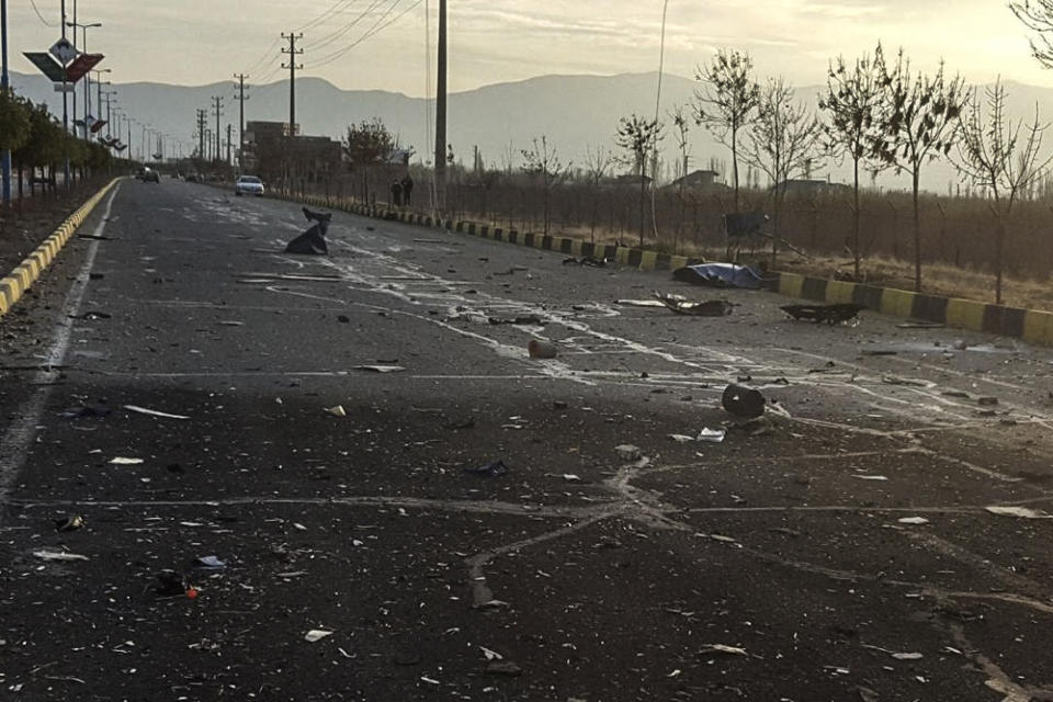 This photo released by the semi-official Fars News Agency shows the scene where Mohsen Fakhrizadeh was killed in Absard, a small city just east of the capital, Tehran, Iran, Friday, Nov. 27, 2020. Fakhrizadeh, an Iranian scientist that Israel alleged led the Islamic Republic's military nuclear program until its disbanding in the early 2000s was “assassinated” Friday, state television said. (Fars News Agency via AP)